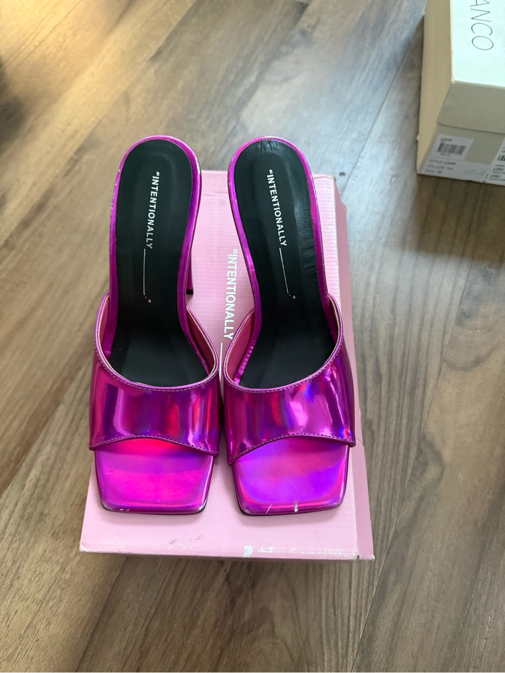 Intentionally blank pink holographic heels
